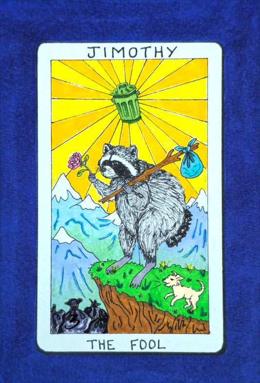 A custom illustrated tarot card titled 'JIMOTHY THE FOOL' featuring a raccoon standing on a cliff with mountains, a trash can, and bags under a bright yellow sunburst. The card is displayed flat against a textured dark blue fabric background.